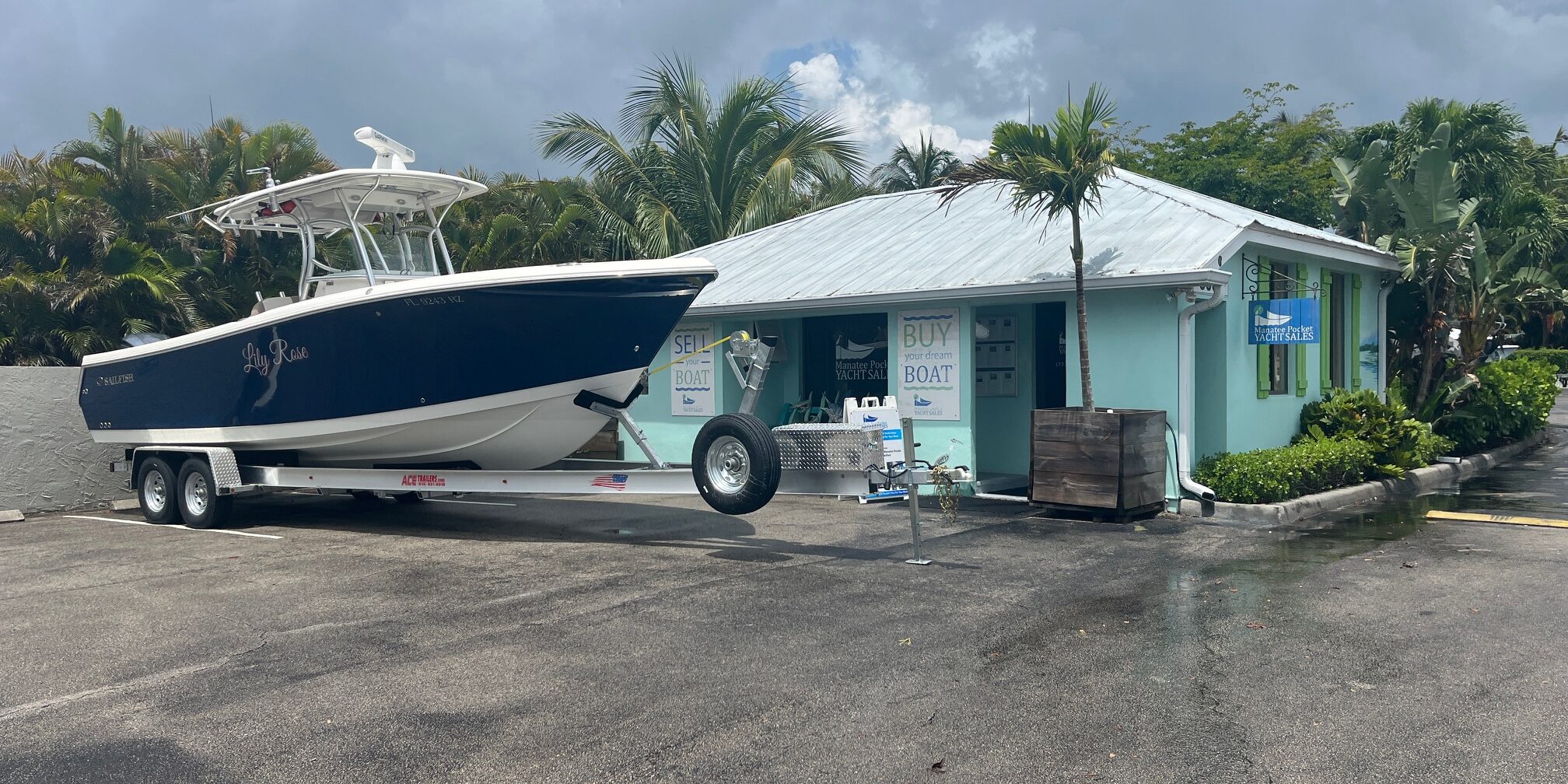 IMG_1748 Manatee Pocket Yacht Sales Office with a boat parked in front